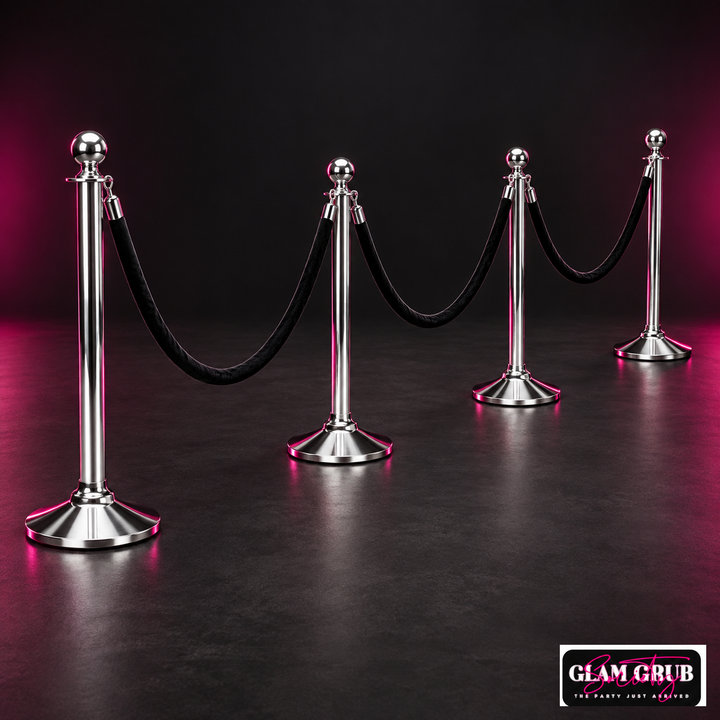 The Silver Spotlight four-pole stanchion and black velvet rope rental set by Glam Grub Society